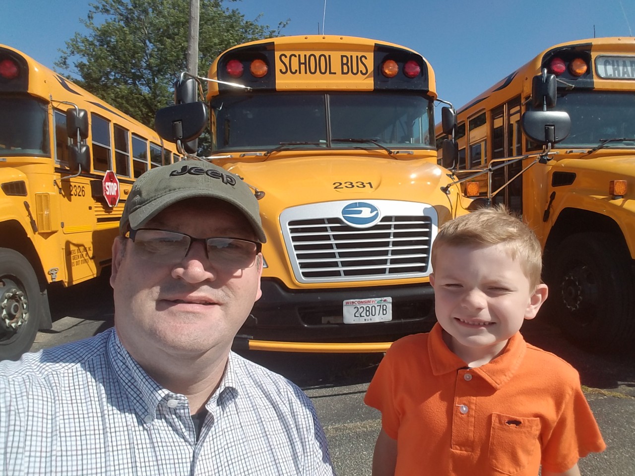 Peter and I in front of a school bus